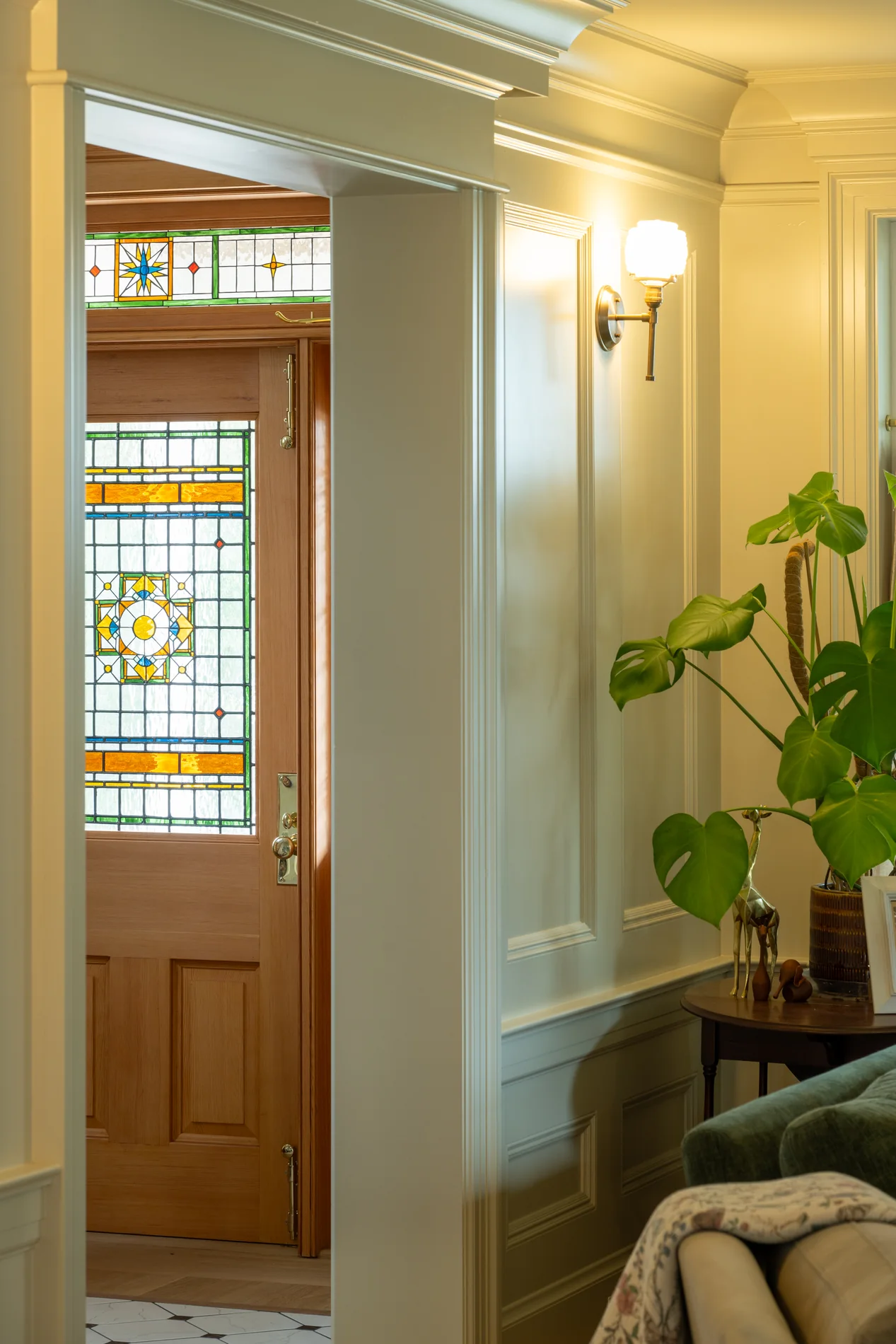 Entry door with decorative colored glass and painted trim